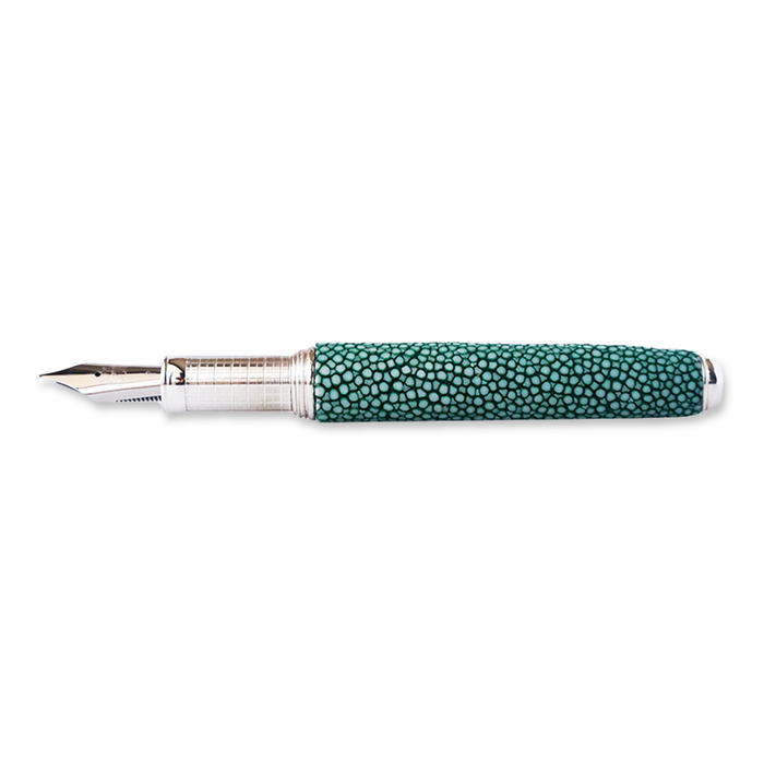 Grifos fountain pen with Raya Green ink, featuring a stylish design and a textured leather grip on a green background.