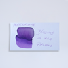 Swatch of Papier Plume DC Pen Show Blossoms on the Potomac fountain pen shimmer ink with vibrant floral-inspired colors.
