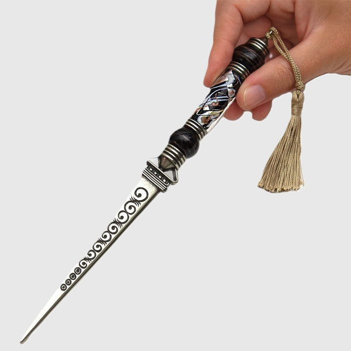 Bortoletti letter opener with a sleek, polished metal blade and decorative handle, ideal for opening envelopes elegantly.