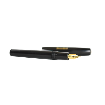Kaweco Classic Sport fountain pen with black body and gold accents, close-up view of the pen’s nib and sleek design.