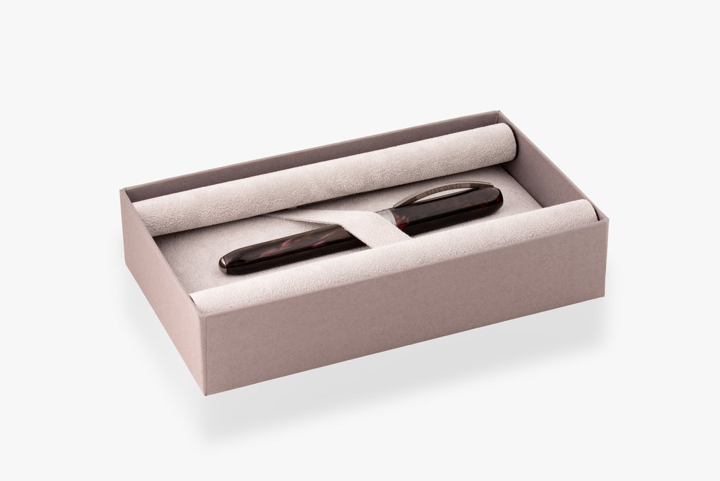 Visconti Comedia Inferno fountain pen with black resin body and gold accents, presented in an elegant box.