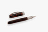 Visconti Comedia Inferno rollerball pen with black and red resin body and silver accents.