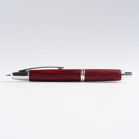 Pilot Vanishing Point fountain pen with a sleek birchwood barrel and gold accents, showcasing its elegant design and craftsmanship.