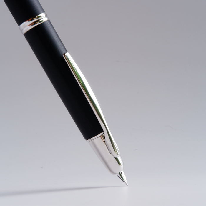Pilot Vanishing Point fountain pen with black birchwood finish, featuring a sleek design and gold accents.