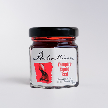Anderillium Vampire Squid Red fountain pen ink in a glass bottle with a black cap and vibrant red ink visible inside.