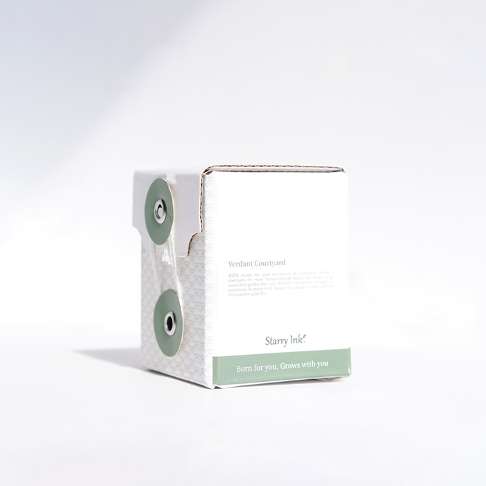 Bottle of Cathay Verdant Courtyard fountain pen ink with vibrant green liquid and elegant packaging.