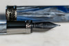 Visconti Comedia Caronte fountain pen with black resin body and gold accents, showcasing elegant design and craftsmanship.