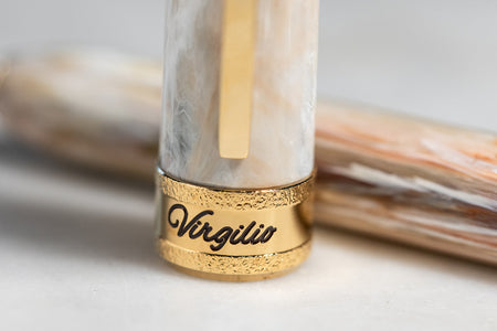 Visconti Comedia Virgilio fountain pen with elegant design and gold accents, showcasing its fine nib and luxurious craftsmanship.