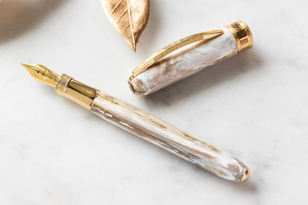 Visconti Comedia Virgilio fountain pen with elegant black and gold design, showcasing the detailed barrel and nib.