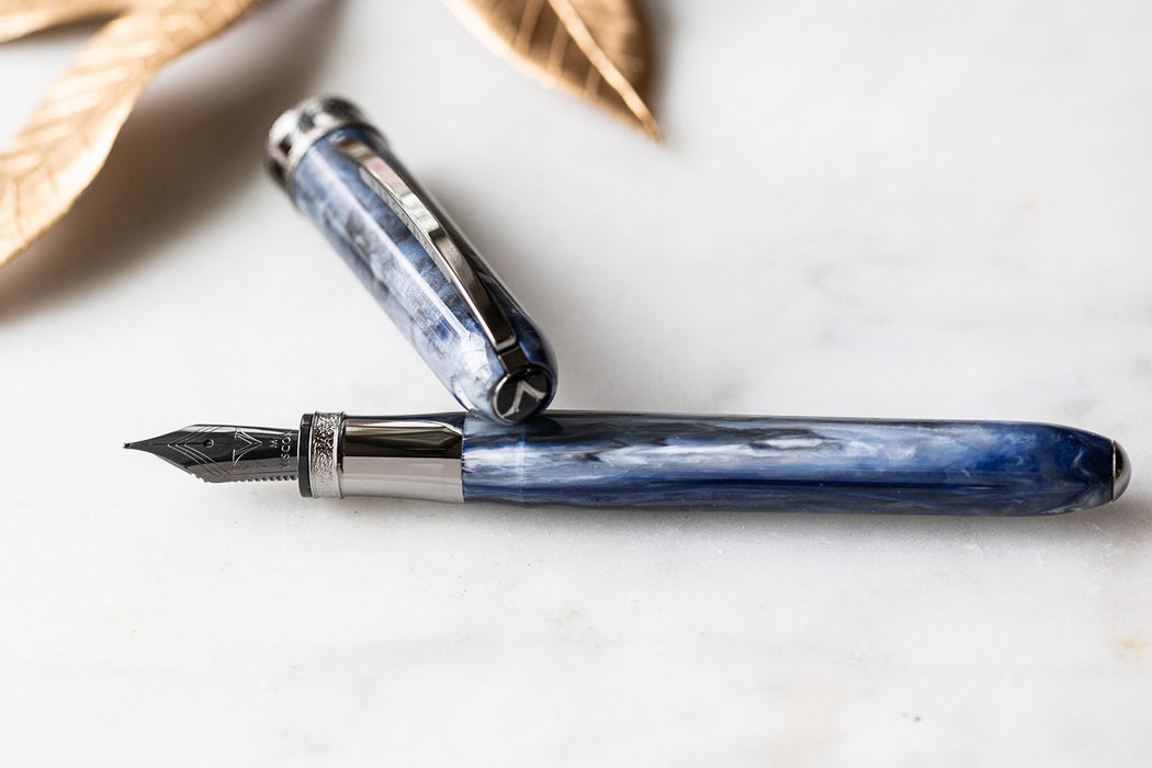 Visconti Comedia Caronte fountain pen with black and gold design, featuring a sleek, elegant appearance and intricate detailing.