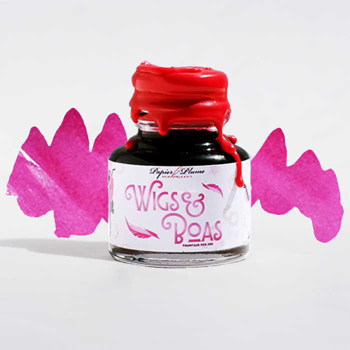 Close-up of Papier Plume New Orleans Collection fountain pen ink bottle with vibrant ink inside.