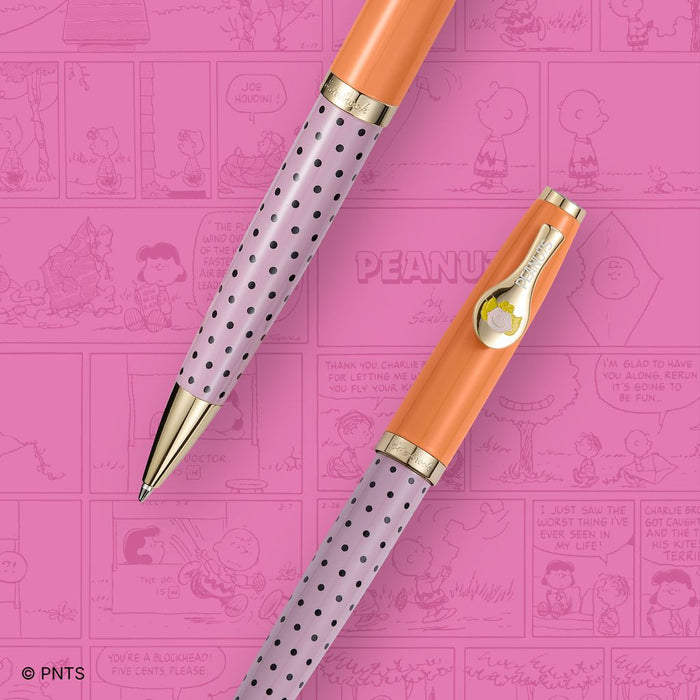 Esterbrook x Peanuts ballpoint pens featuring Snoopy and Charlie Brown in colorful designs on sleek metal bodies.