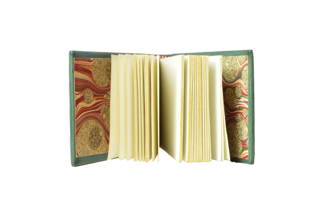 Small French 18th-century sketchbook journal by Anima Sola Fine Books, featuring antique-style cover and handwritten sketches inside.
