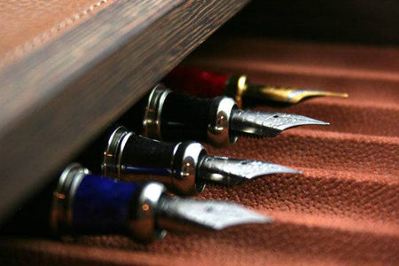 Gray Atelier De La Foret 22 Pen Box with multiple compartments for organizing pens and writing instruments.