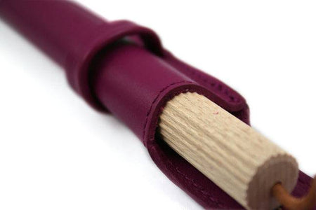 Atelier de la Foret pen pouch with one pen, large size, in various colors, designed for storing writing instruments.