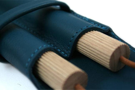 Atelier de la Foret large pen pouch with two pens, available in various colors, designed for storing writing instruments.