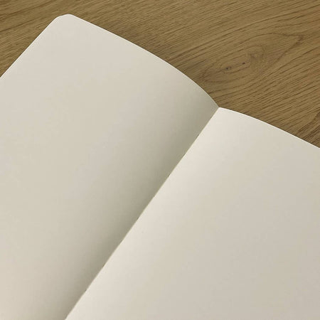 Medium Schemes Journal by The Mincing Mockingbird featuring a textured cover with intricate patterns and a sturdy binding.