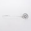 Le Potier D'Etain fishhook bookmarks featuring intricate metal designs, ideal for marking pages in books.