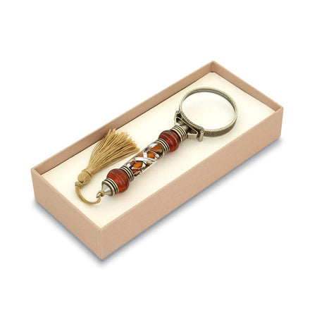 Bortoletti Murano Glass magnifying glass with amber handle, silver leaf accents, and tassel for elegant inspection.