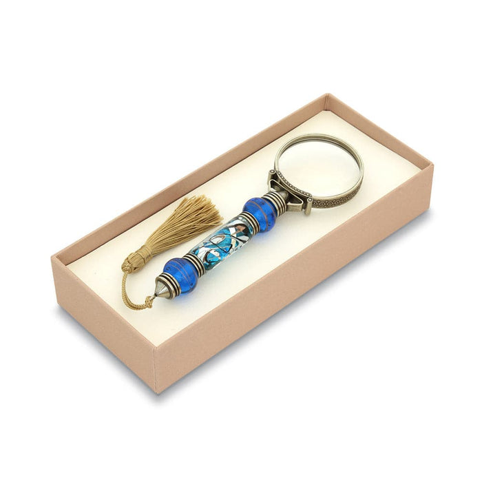 Bortoletti Murano glass magnifying glass with amber handle, silver leaf accents, and tassel for elegant viewing.