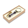 Bortoletti Murano glass magnifying glass with amber handle, silver leaf accents, and tassel, showcasing intricate craftsmanship.