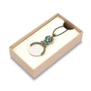 Black Bortoletti pocket or necklace magnifying glass with a compact, round lens and stylish design.
