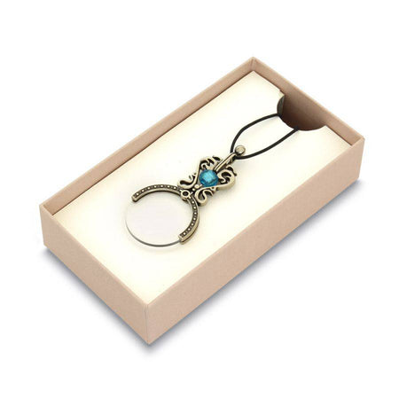 Black Bortoletti pocket or necklace magnifying glass with a compact, round lens and stylish design.