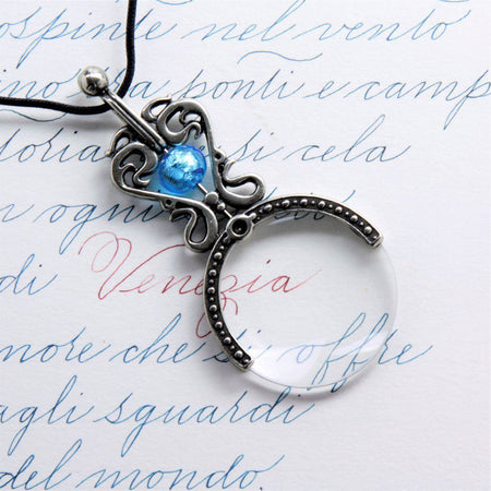 Black Bortoletti pocket or necklace magnifying glass with a compact, stylish design, suitable for close-up viewing.