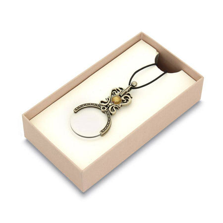 Black Bortoletti pocket or necklace magnifying glass with a compact, stylish design and ergonomic handle.