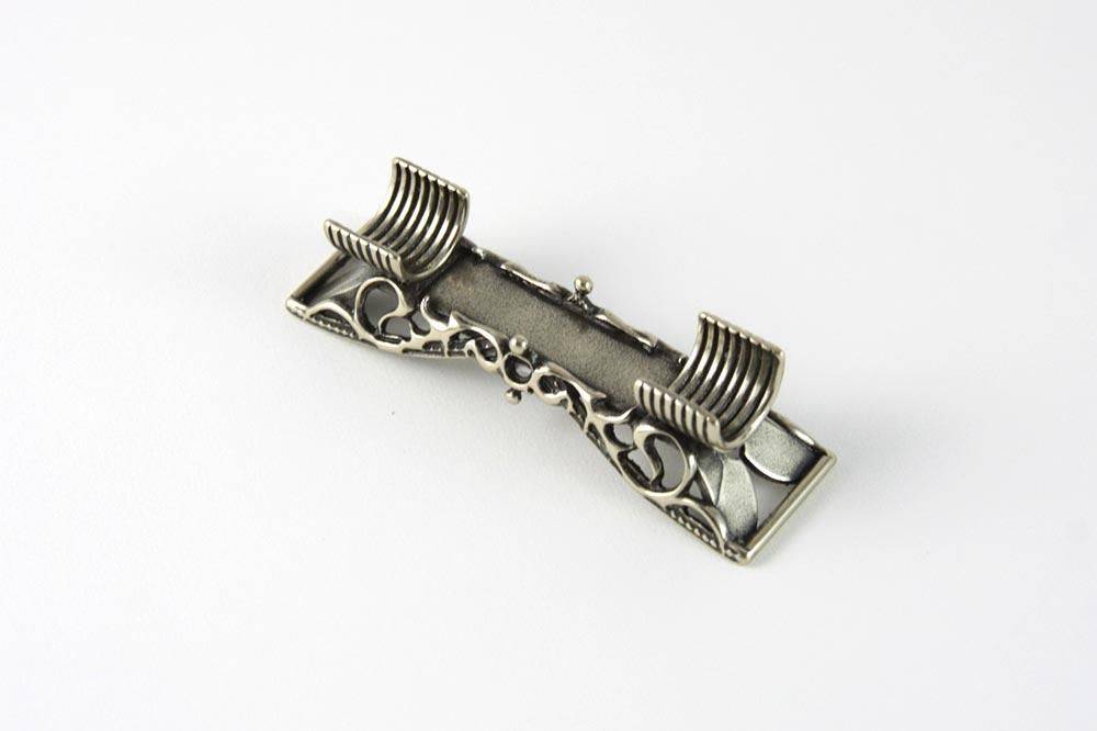Bortoletti lace and cradle pen rest with intricate lace design and elegant cradle for holding pens or writing instruments.