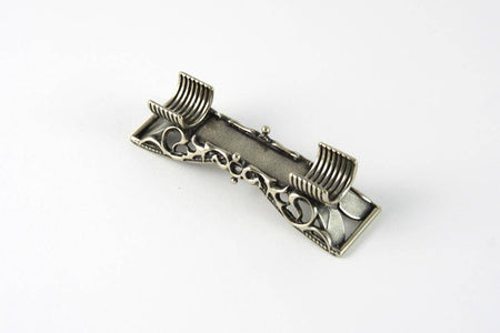 Bortoletti lace and cradle pen rest with intricate lace design and elegant cradle for holding pens or writing instruments.
