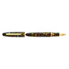 Esterbrook Estie fountain pen with gold fittings, displayed on a botanical gardens background, showcasing the elegant writing instrument.