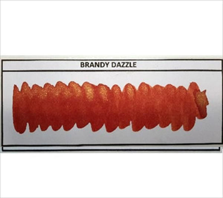 Diamine Shimmertastic Brandy Dazzle shimmering fountain pen ink in a glass bottle with a deep caramel color and glitter accents.