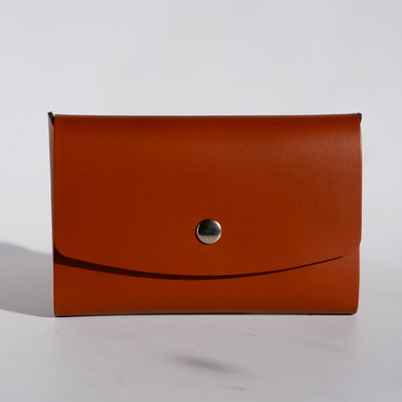 Brown Papier Plume Swatch Card Holder made from regenerated leather, designed to hold and organize swatch cards.