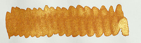 Diamine Shimmertastic Caramel Sparkle fountain pen ink bottle with shimmering caramel-colored ink and glittery accents.