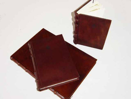 Leather-bound address book with traditional spine by Cartiglio, featuring a hard cover and vintage-style design.