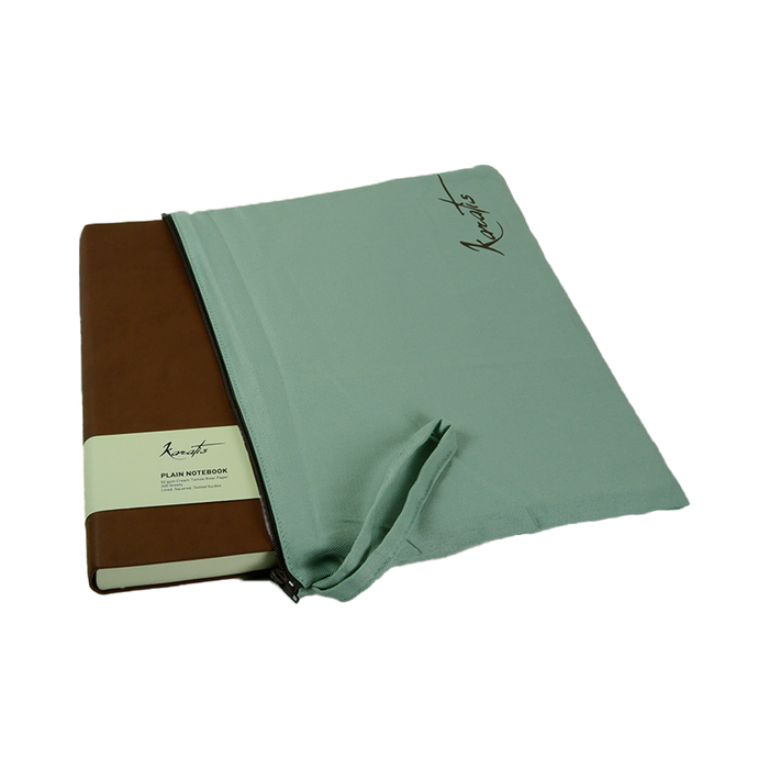 Karatis B5 size notebook with golden brown Tomoe River paper, featuring a sleek cover and high-quality writing surface.