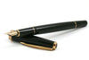 Cleo Skribent Classic Gold fountain pen with black body and gold accents, cartridge/converter style, featuring an extra-fine nib.
