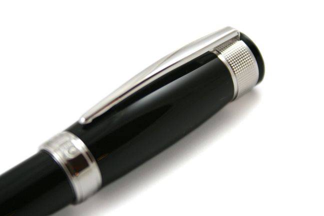 Cleo Skribent Aura fountain pen with black ink, featuring a sleek design and fine nib for smooth writing.