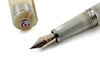 Cleo Skribent Aura fountain pen with mother of pearl finish, featuring an elegant design and extra-fine nib for writing perfection.