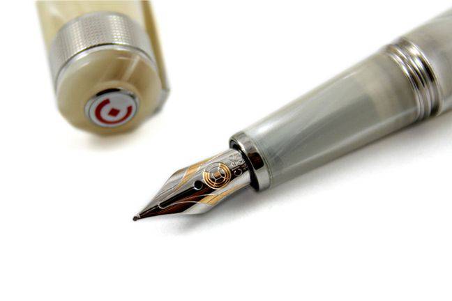 Cleo Skribent Aura fountain pen with mother of pearl finish, featuring an elegant design and extra-fine nib for writing perfection.