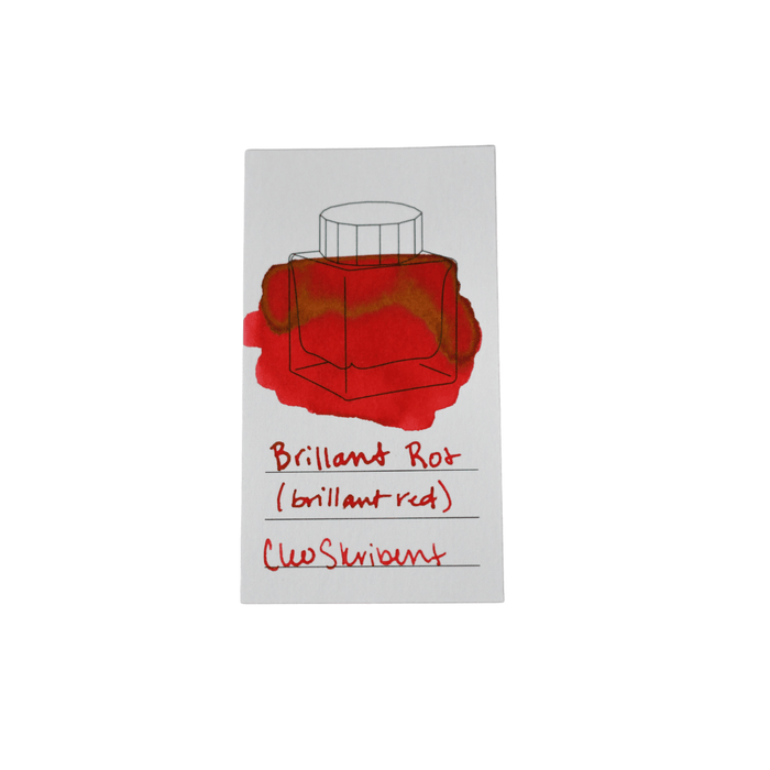 Cleo Skribent bottled fountain pen ink in Brilliant Red with a glass ink bottle and red ink visible inside.
