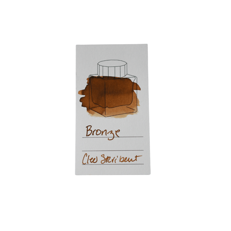 Cleo Skribent bronze fountain pen ink bottle with a clear glass container and black cap, designed for elegant writing.