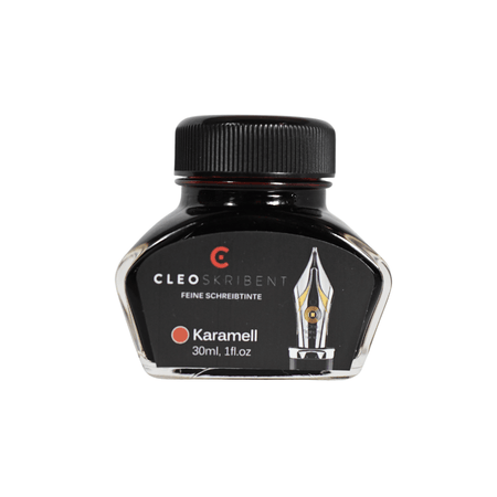 Cleo Skribent bottled fountain pen ink in caramel color, shown in a glass ink bottle with a black cap and label.