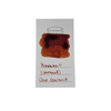 Cleo Skribent bottled fountain pen ink in caramel color, with the ink bottle showing a clear glass container and ink inside.