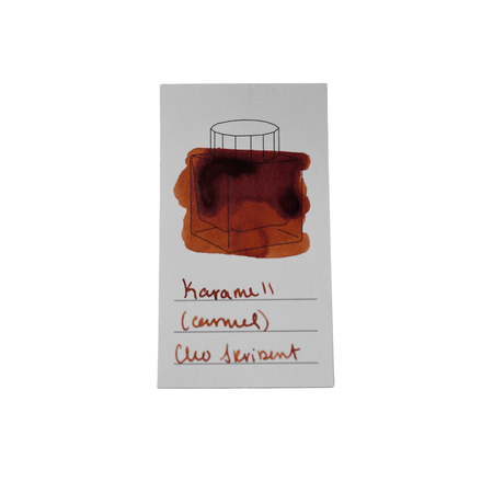 Cleo Skribent bottled fountain pen ink in caramel color, with the ink bottle showing a clear glass container and ink inside.
