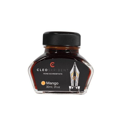 Cleo Skribent bottled fountain pen ink in mango color, shown in a glass ink bottle with label and vibrant orange ink inside.