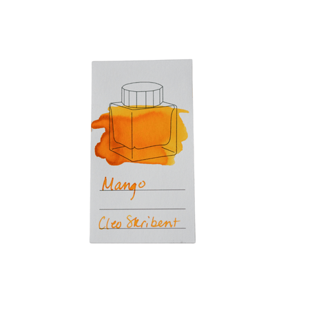 Cleo Skribent bottled fountain pen ink in vibrant mango color, shown in a glass ink bottle with label.