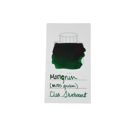 Cleo Skribent bottled fountain pen ink in Moosgrun moss green, shown in a glass ink bottle with green ink visible inside.