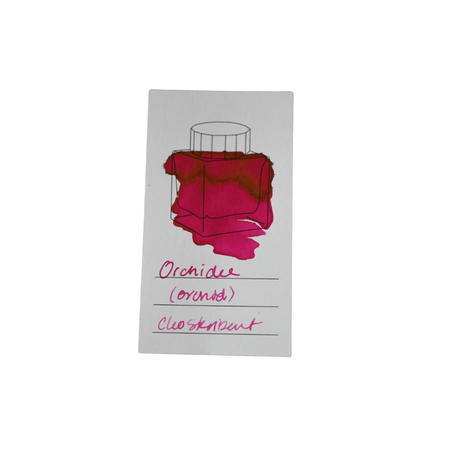 Cleo Skribent bottled fountain pen ink in Orchidee (orchid) color, with a clear glass ink bottle showing vibrant purple ink.